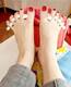 Bare feet with red polish